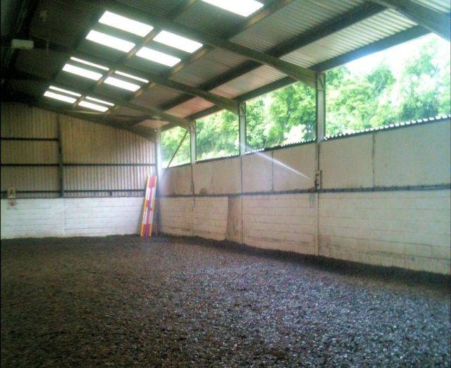 Sprinkler in indoor horse riding arena