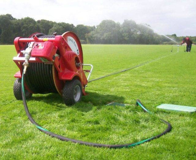Reel irrigator on football pitch