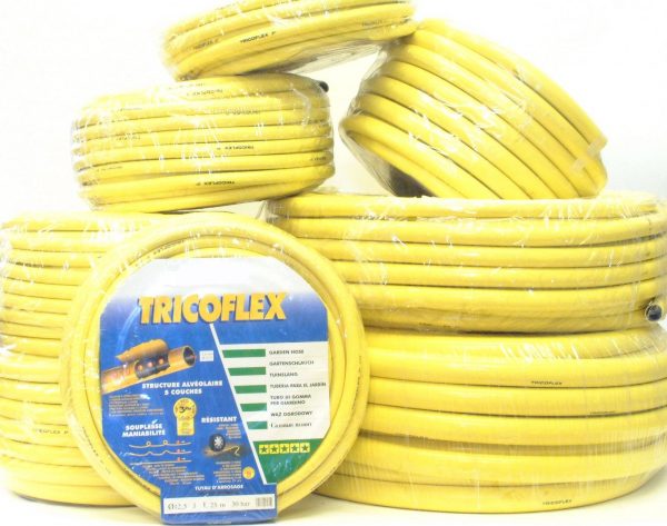 Coils of yellow, multi-layer Tricoflex hose for professional use