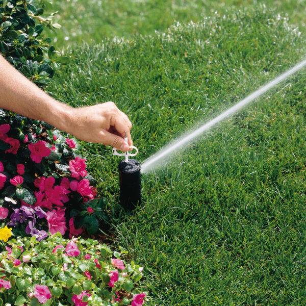 Image of how to use Hunter nozzle Key for Hunter rotor sprinklers
