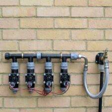 tap manifold for battery irrigation controllers
