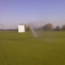 Pop-up cricket square irrigation package including pump and storage tank with automatic control