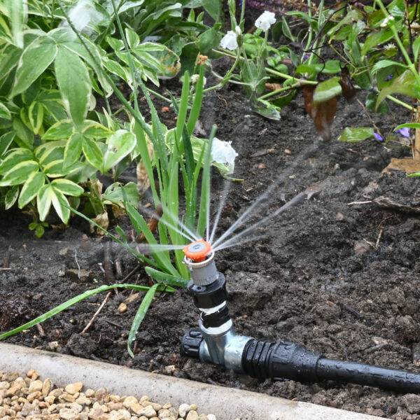 Border spray watering kit with gentle half circle sprinklers