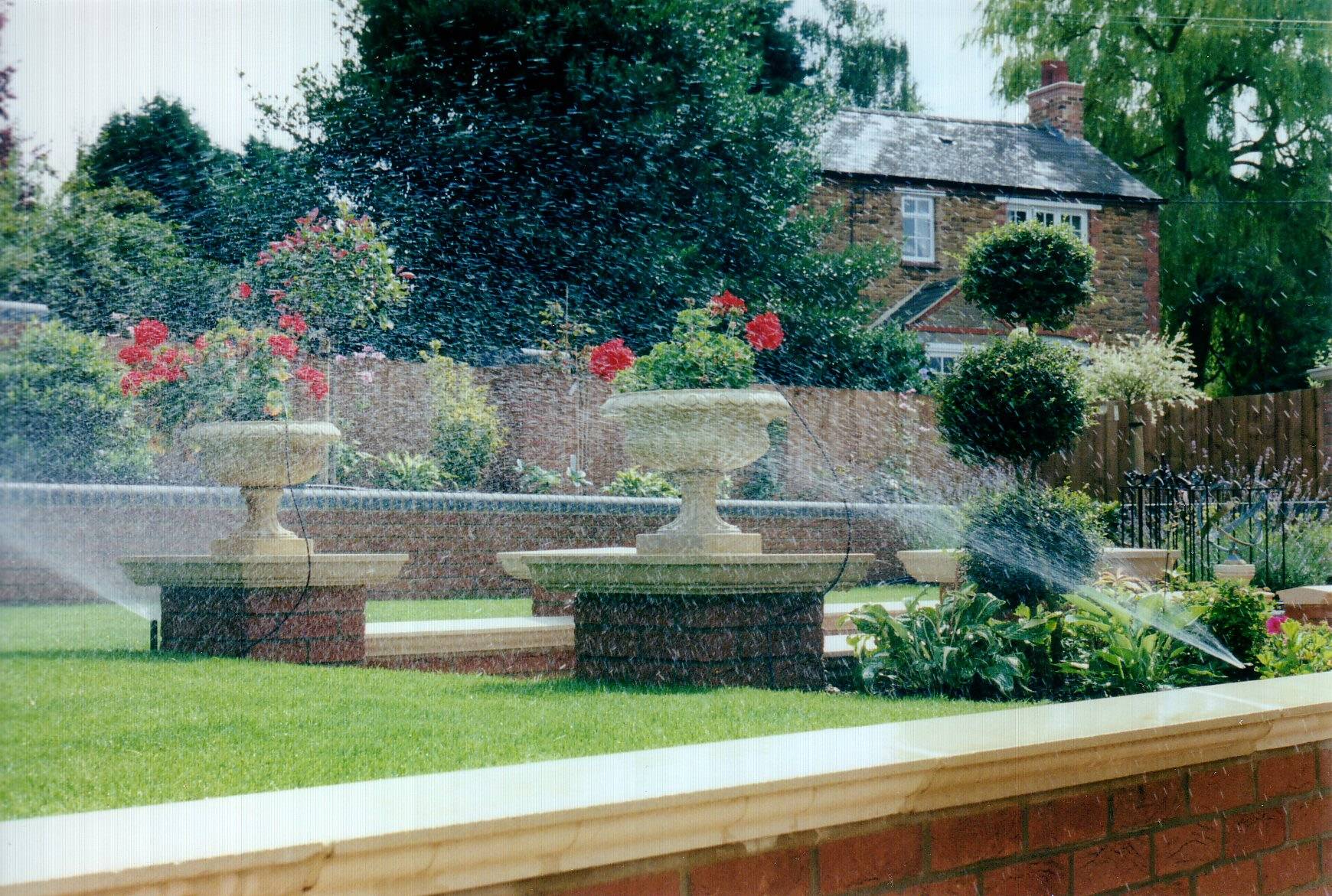 Garden with pop up lawn watering sprinklers